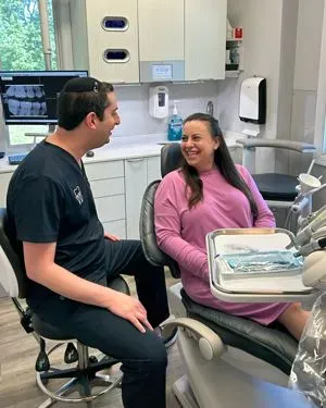 Morris Plains Center for Dentistry dentist consulting with patient in treatment room